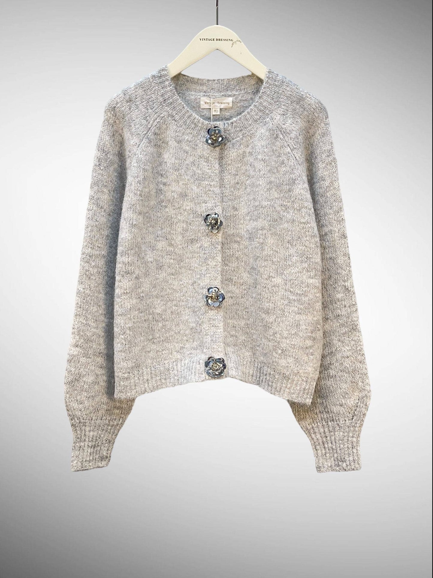 Strickweste mit Glitzerblumen
