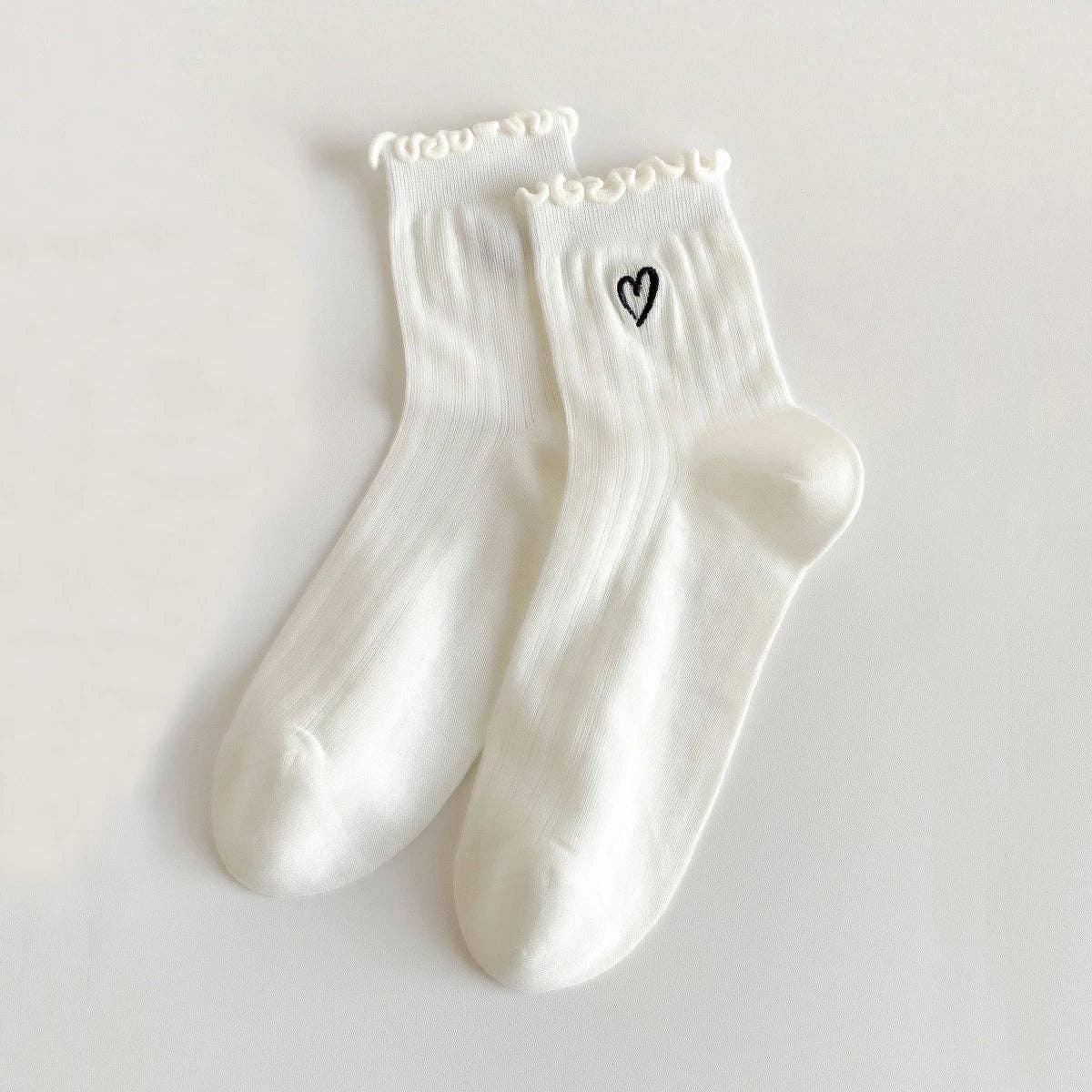 Zarte Socken mit Herz